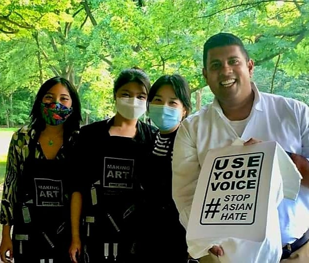 A group of people wearing face masks

Description automatically generated